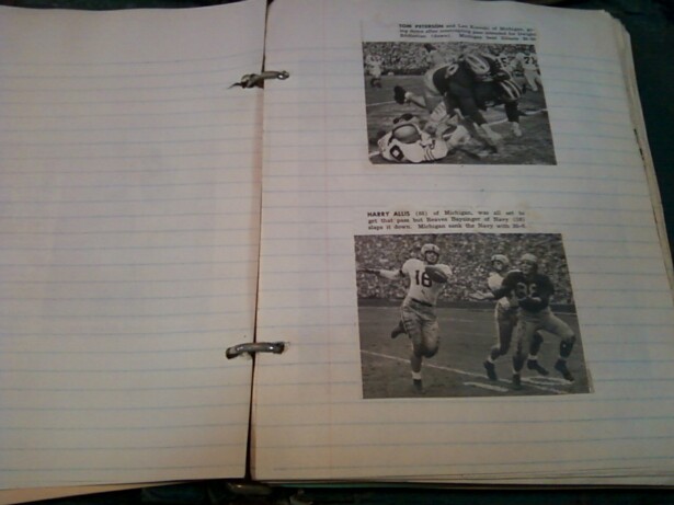 Image description: 2 newspaper clippings containing black and white photos from reports on old college American football games are glued onto a ruled page of binder paper in a scrapbook. In the pictures from the clippings, white men play American football. In the top clipping, a scrum of football players appears. In the bottom clipping, a white man wearing a number 16 jersey runs with a fooball while two other white men stand nearby, one wearing a dark jersey, possibly with a number 38 on it. There is text above the photos in the clippings, but it is not entirely legible in the picture.