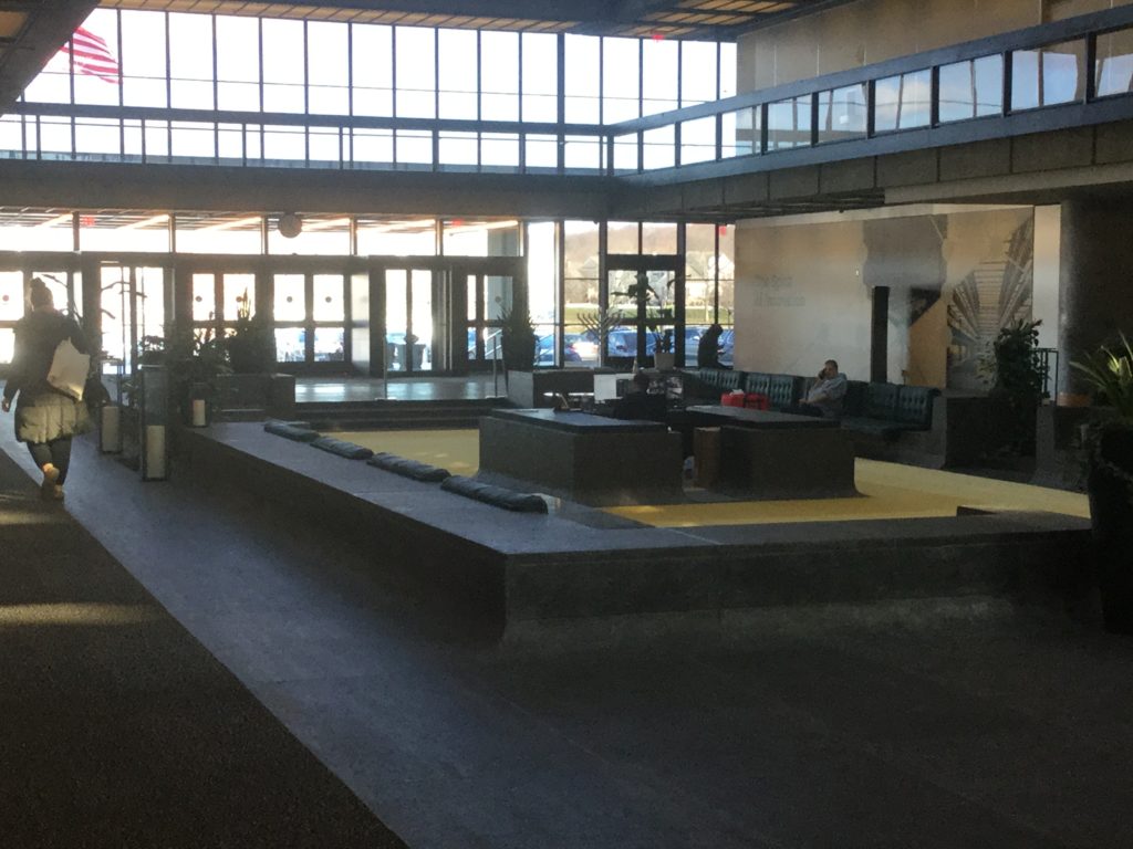 People mill about the front lobby of Bell Works, the former Bell Labs Holmdel Complex in Holmdel, NJ.