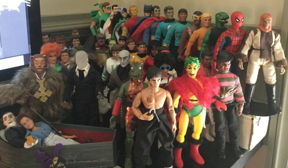 A large group of Mego-scale action figures, too many to list in a polite image caption, are pictured.