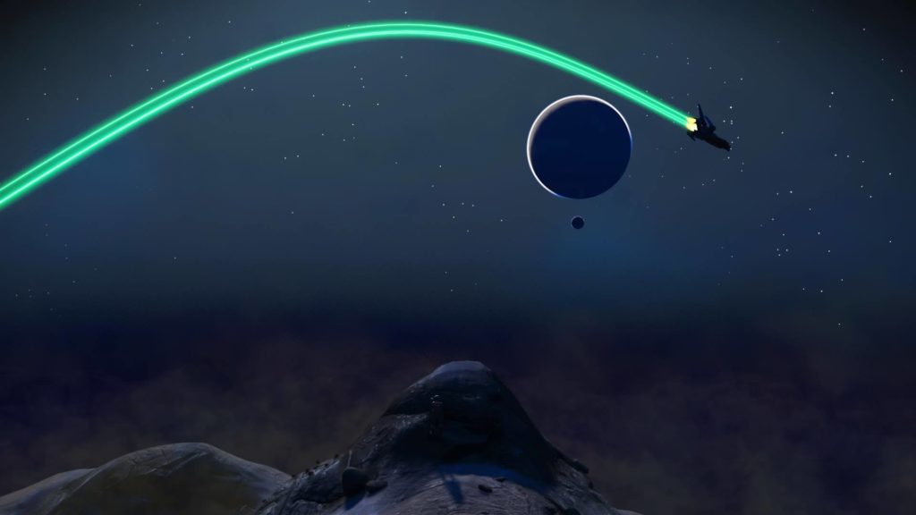 Screenshot from the video game No Man's Sky. A space ship flies through a star-lit stretch of outer space, past the silhouette of a planet, and over grey hills on the horizon, leaving a green vapor trail behind it.